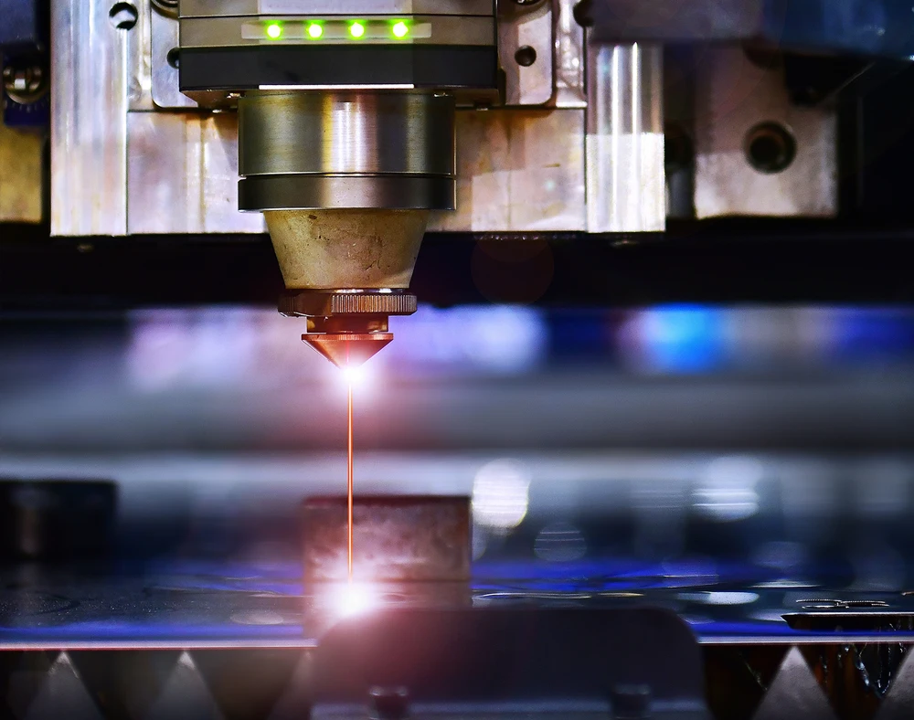 Industrial laser cut machine while cutting the sheet metal